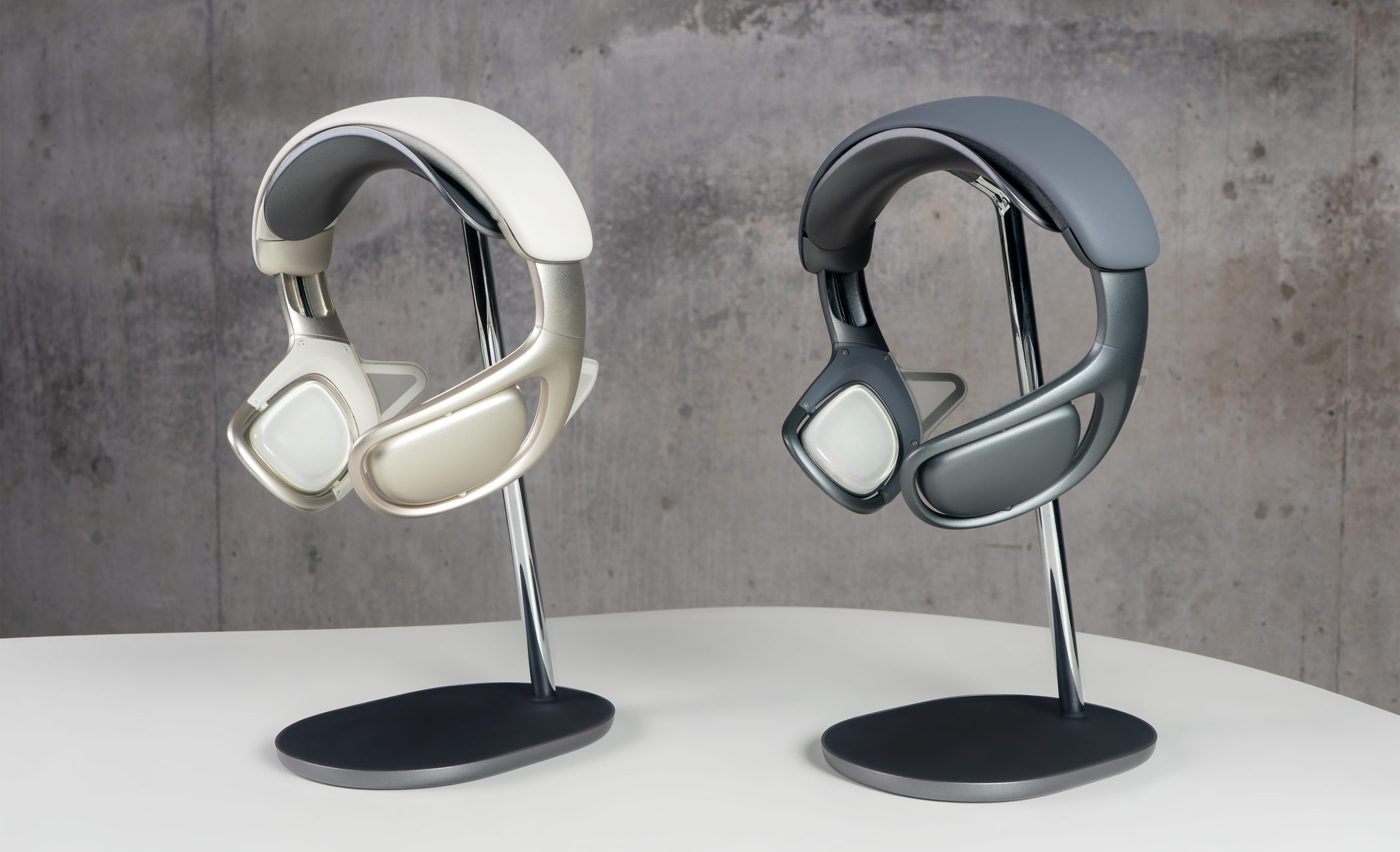 Two prototype Nudge headset devices on display stands